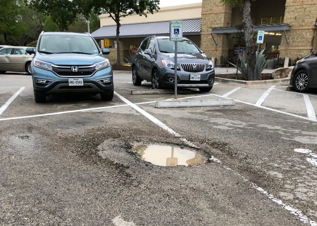 Pot hole at retail propety in Austin, TX | How to prevent rain damage