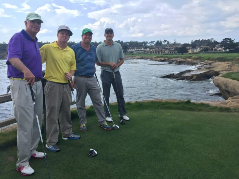 Leigh with his dad and brothers on the 18th hole at Pebble Beach Golf Links.